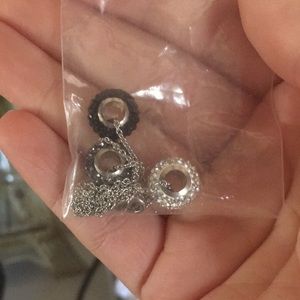 Silver, grey and black three pendent necklace.